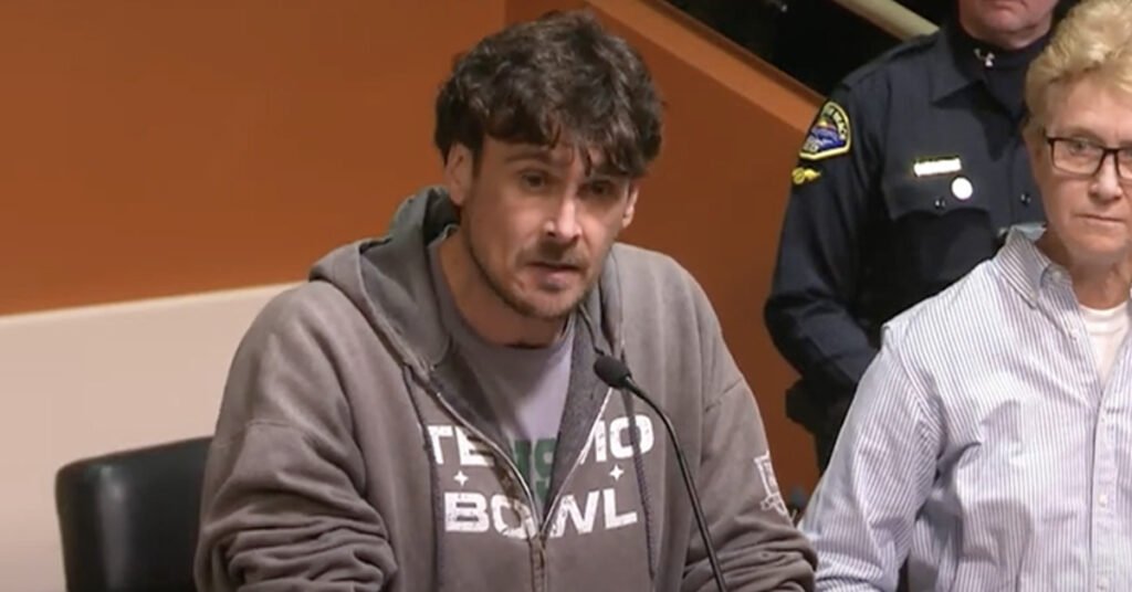Ex-NFL punter Chris Kluwe protests during a Huntington Beach City Council meeting